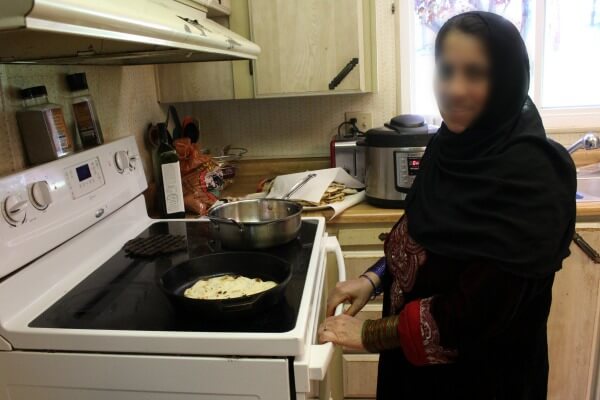 Refugee wife cooking